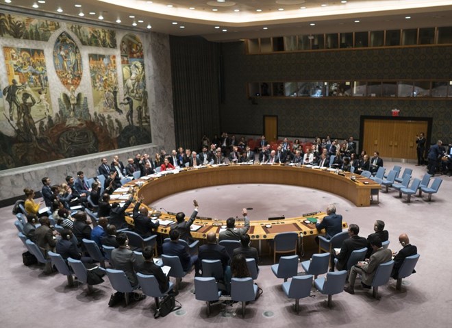 In this Saturday, Feb. 24, 2018, file photo, members of the United Nations Security Council vote on a resolution at United Nations headquarters. U.S. President Donald Trump is set to chair a U.N. Security Council meeting for the first time, on Wednesday, Sept. 26, 2018. The meeting will put the “America First” president around a table with representatives from countries with fraught relationships with the U.S., including Russia and China. (AP Photo/Craig Ruttle, File)