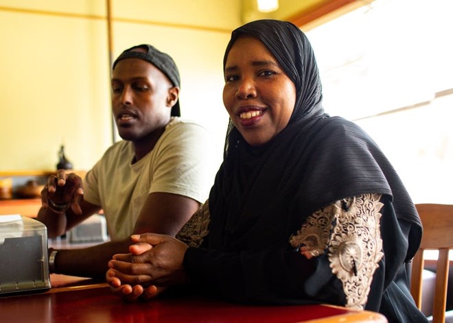 Chef Jamal Hashi sits next to Karima Omer, owner of Sabrina's Cafe & Deli in St. Paul. Nicole Neri for MPR News